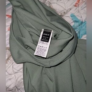 It’s a bodycon jumpsuit that’s only worn once. It’s a small that fits a size 4.